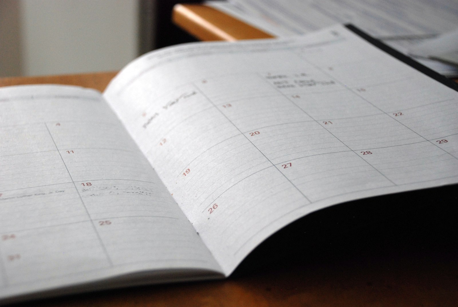 An open monthly calendar on a desk